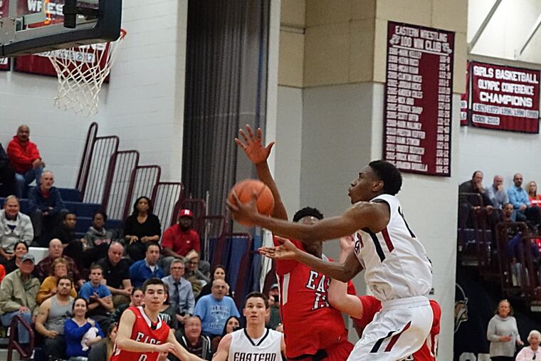 Eastern’s Matt Cotton drives for his winning basket against Cherry Hill East.