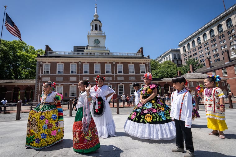 Young dancers from Ñuuxakun, a group that performs Baile Folclorico Mexicano, participate in the Red, White, & Blue To-Do Pomp & Parade on Independence Mall Tuesday.