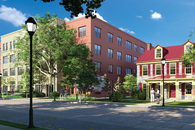 A view of the apartment building from the southwest side with the historic home at 6901 Germantown Ave. seen on the right.