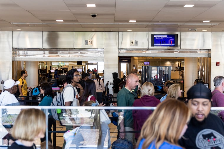 People waiting in the TSA line at Philadelphia International Airport.