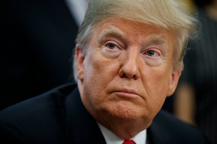 President Donald Trump listens to a question during a signing ceremony for the "Save Our Seas Act of 2018" in the Oval Office of the White House, Thursday, Oct. 11, 2018, in Washington.