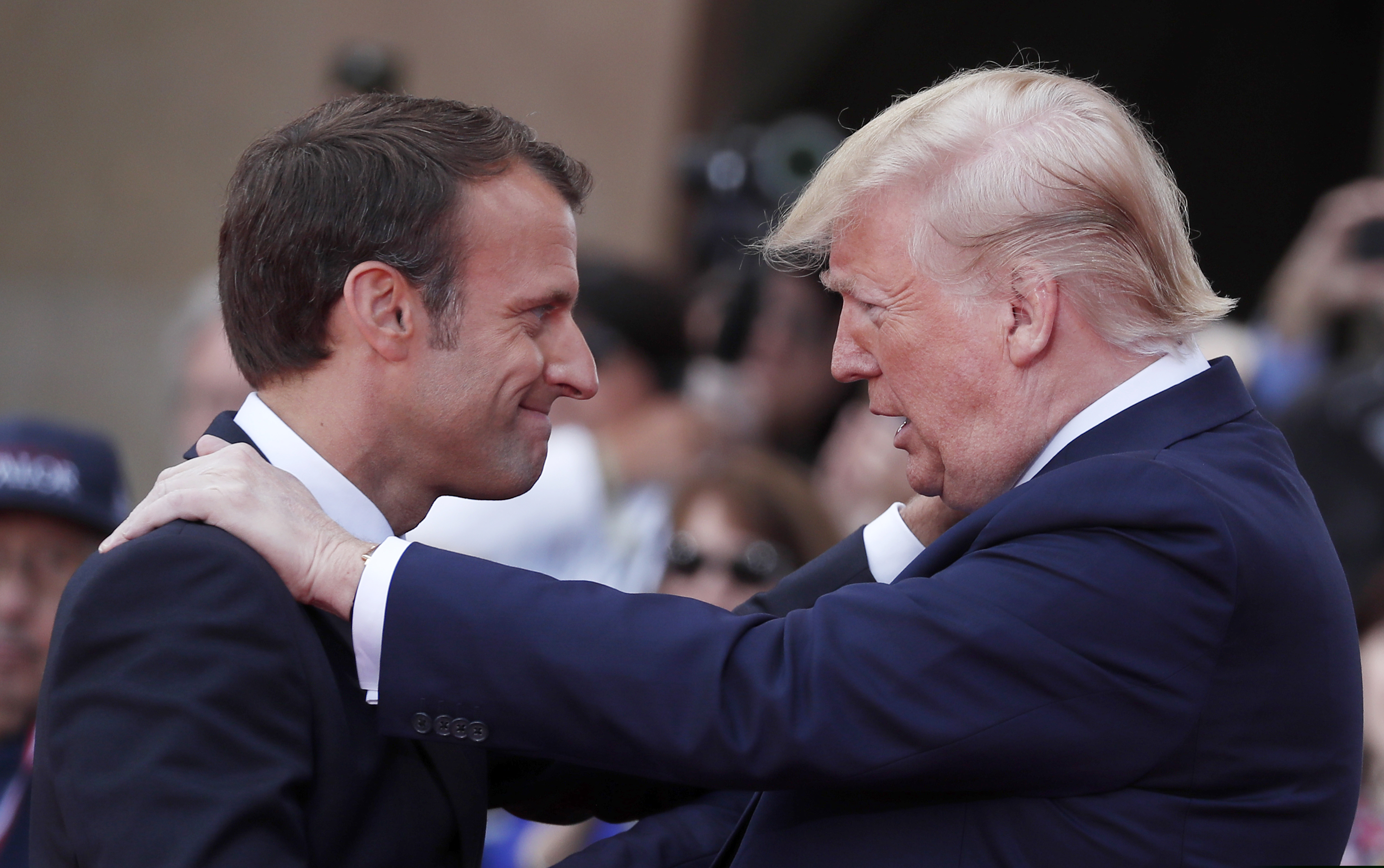 French President Emmanuel Macron (left) meets U.S President Donald Trump during a ceremony to mark the 75th anniversary of D-Day at the Normandy American Cemetery in Colleville-sur-Mer, Normandy, France, on Thursday.