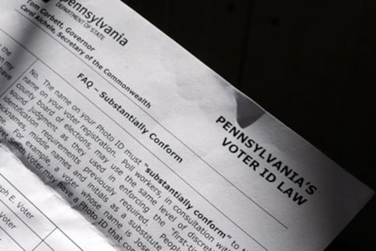 At his Berwyn home September 24, 2012, Tony DeCarlo holds copy of the information sheet - intended for poll workers - after he tried to get assurance from the state that he would be able to vote even though there is a discrepancy with the names on his IDs. His name on driver's license, his passport and his voter registration don't match. He was given the copy after seeking infor from elected officials. The letter points out acceptable variations of names, which "substantially conform." ( TOM GRALISH / Staff Photographer )