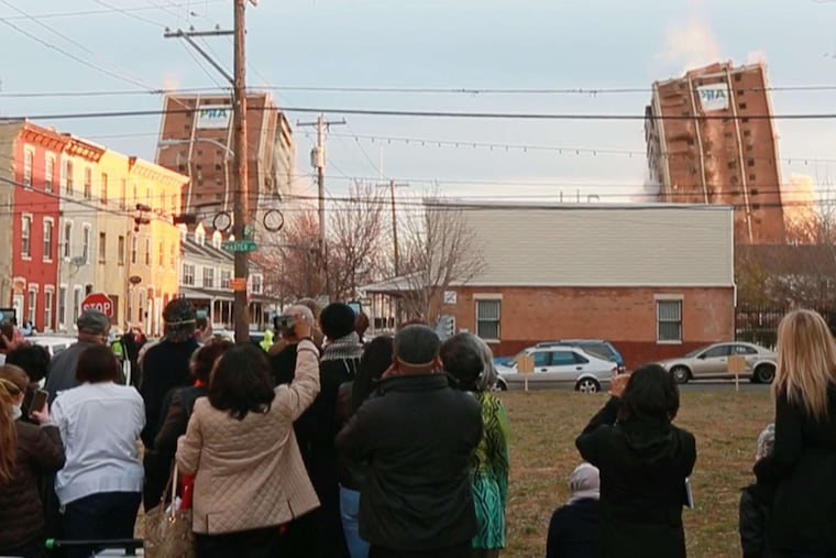 Resident lined the streets and some took photographs as the Norman Blumberg Apartments, which rose to fanfare in 1967, were imploded in 2016.