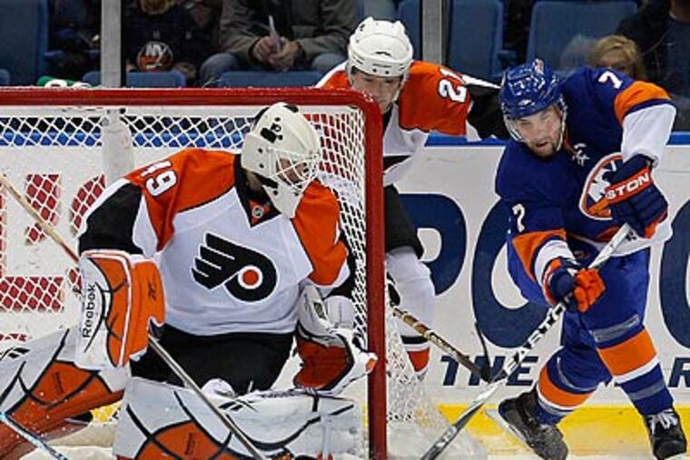 Flyers goaltender Michael Leighton made 28 saves against the Islanders. (Kathy Willens/AP)