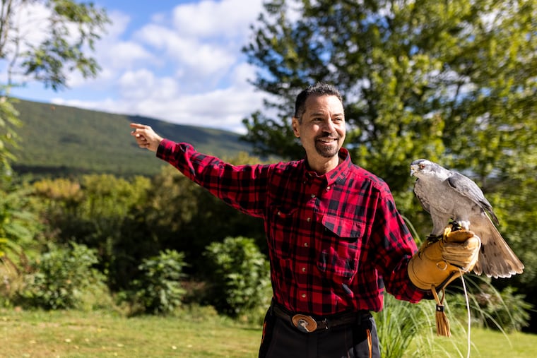 Mike Dupuy, falconer, shows the mountains near his home where he explores looking for nests of goshawks in Middleburg, Pa.