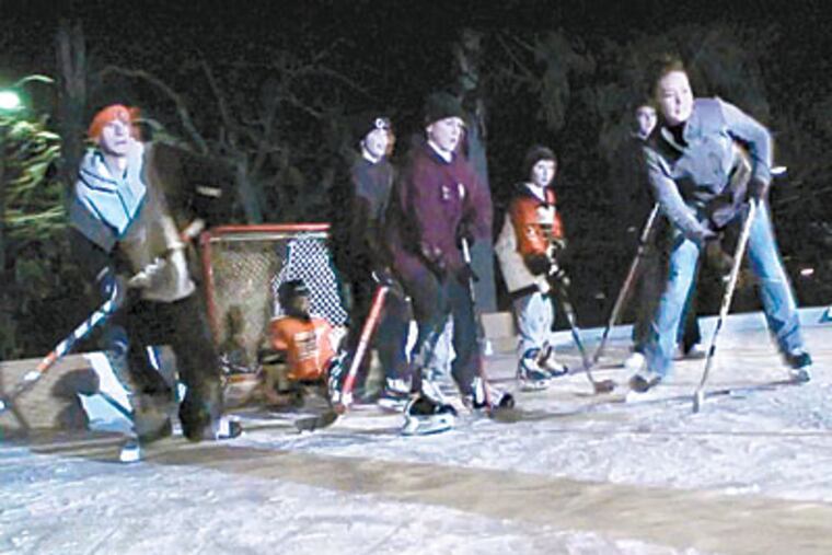 Angela DeRita (right) joins friends and family in a backyard scrimmage on the rink her father and uncle built in Broomall. (Ron Tarver / Staff Photographer)