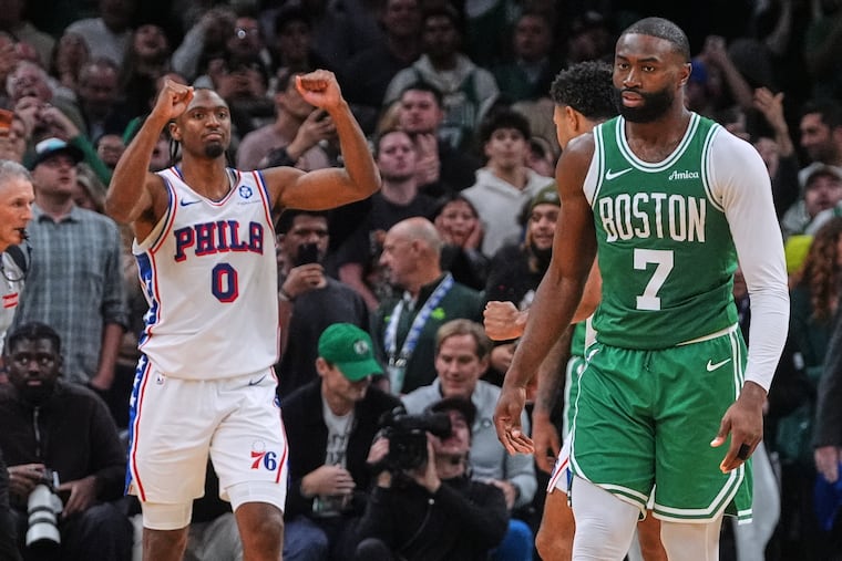 Sixers guard Tyrese Maxey (left) celebrates after defeating the Boston Celtics in Wednesday's season opener.