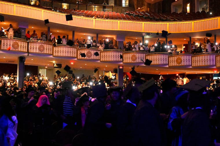 Caps are tossed after graduates received their diplomas during the 2026 Summer Graduation Ceremony at the Met, on Thursday.