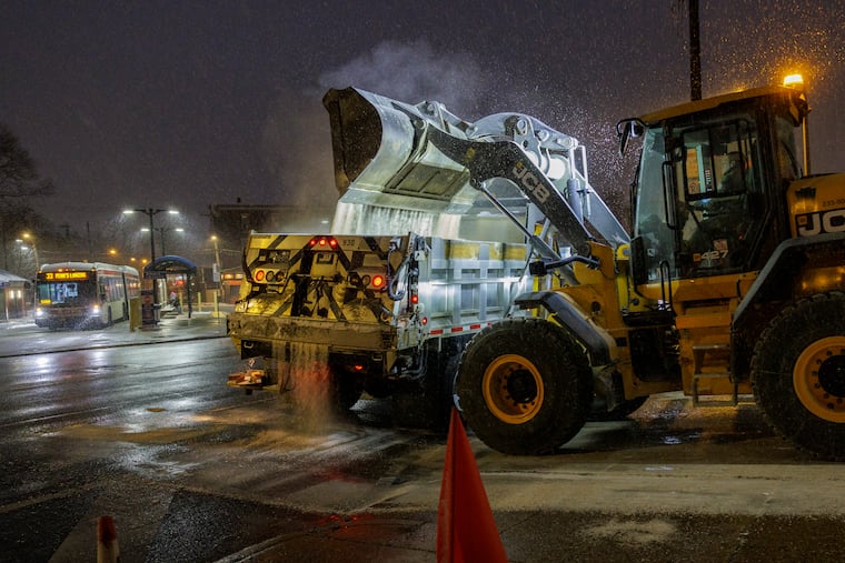 PennDot trucks load up on salt at their facility on Hunting Park Avenue near Wissahickon one year ago. They are again dealing with snowy conditions on Philadelphia area roads and restricting speed limits on several highways.