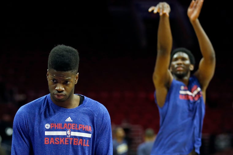 Nerlens Noel, the first product of The Process, prepares to shoot in 2015 as teammate Joel Embiid, the only tangible asset the scheme ever produced, shoots behind him.