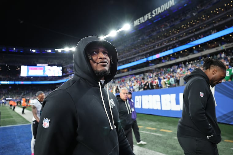 Eagles defensive tackle Jalen Carter, who was inactive for the game, walks off the field after the loss to the Giants.