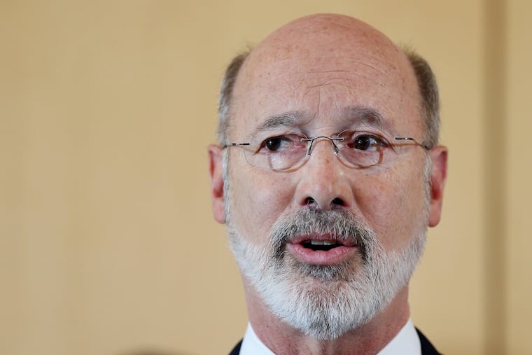 Gov. Tom Wolf signed a package of budget bills that will provide more money for education, including safety in schools and communities across the state. TIM TAI / Staff Photographer