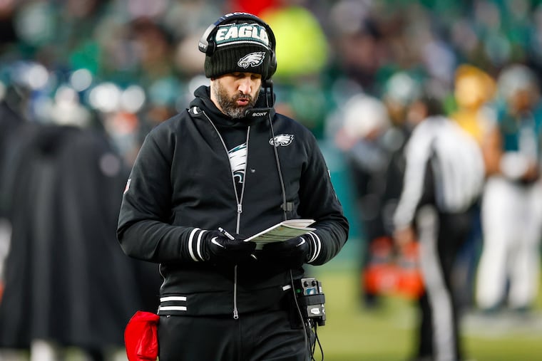 Eagles coach Nick Sirianni peruses what turned out to be an insufficient play sheet during the Eagles' wild-card loss to the visiting 49ers on Sunday.