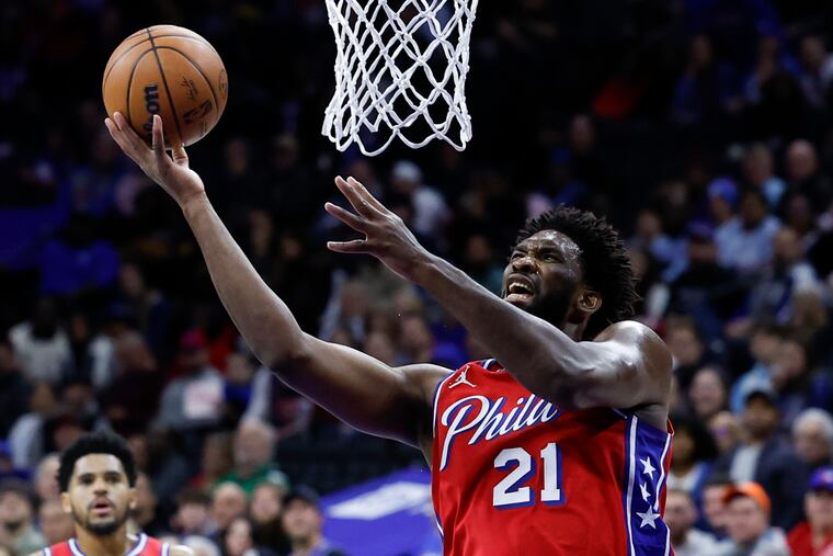 Sixers center Joel Embiid drives to the basket against the Detroit Pistons on Friday on his way to two of his game-high 35 points.