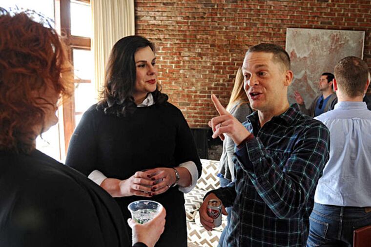 Kim Otto (left) and Jay Lassiter co-host a brunch at Lassiter's house in Cherry Hill. 'We're trying to figure out how to leverage this historic visit,' Jay Lassiter said.