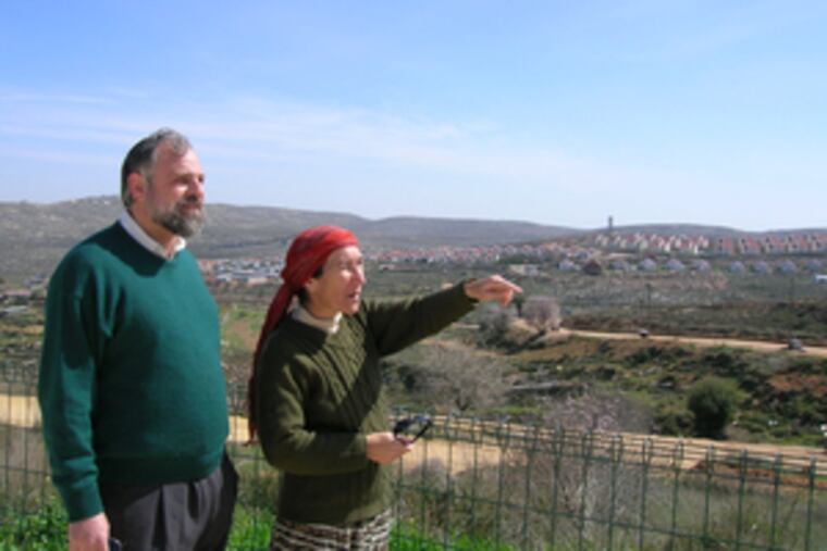 "Moving here was like coming home," says Philadelphia native Steven Siegel, looking out at Shilo's hills in the West Bank with his wife, Pnina.