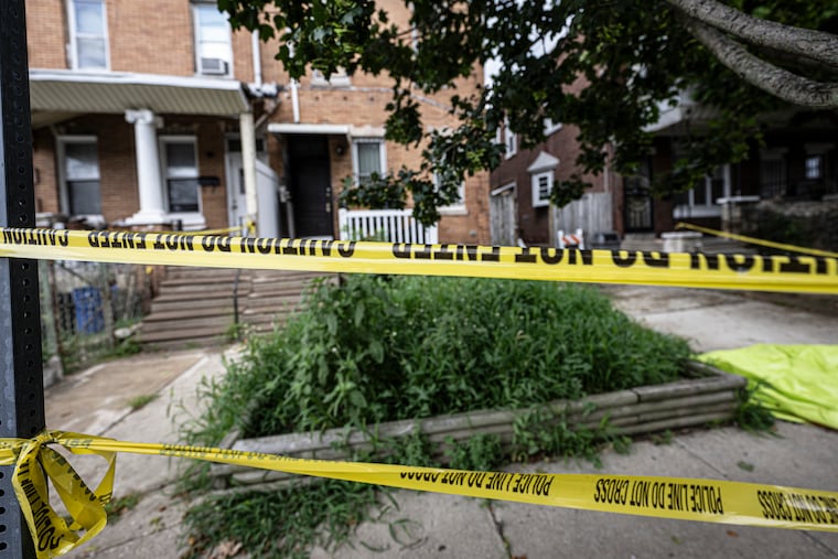 Police tape entrance of the home of Eugene Albert Horsch on West Chew Avenue in the Olney section of Philadelphia as investigators search for possible evidence.