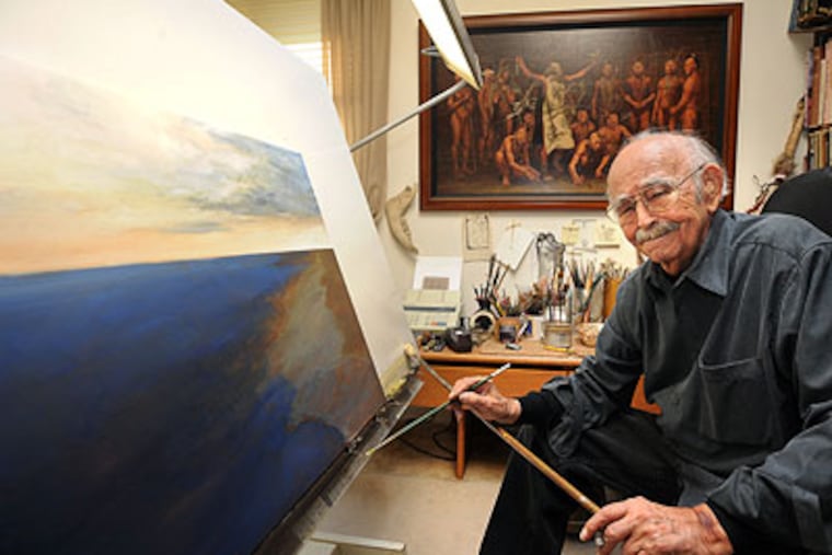 Artist Louis S. Glanzman, 88, inside the studio at his Medford home. (Sharon Gekoski-Kimmel / Staff Photographer)