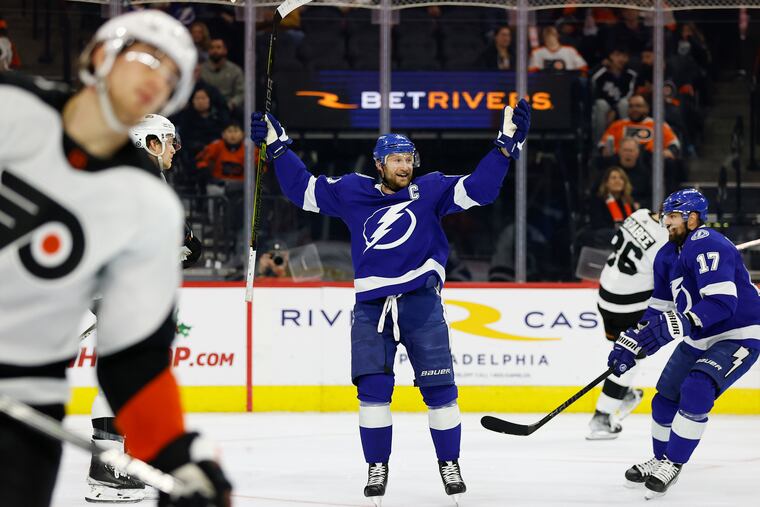 Tampa Bay Lightning center Steven Stamkos celebrates his 1000th career point with teammate left wing Alex Killorn. Stamkos assisted on left wing Nicholas Paul's second-period goal.