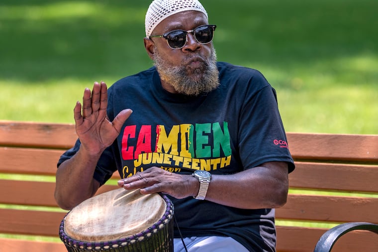 Tayyab Rasheed lays down the beat with a djembe African drum during a Juneteenth celebration and ceremony at the Slave Marker at Front and Cooper Streets in Camden, Sunday, June 18, 2023. A Juneteenth Festival will be held in Camden Sunday, June 21, and Cherry Hill will hold a festival Saturday, June 20.