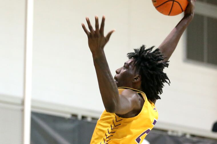 Aaron Bradshaw of Camden High goes up for a dunk against Archbishop Ryan during the Philly Live tournament for high school teams and the opportunities for college coaches to view large numbers of players. It was played at Jefferson University on June 17, 2022 and the following days.