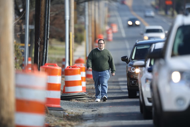 Rick Krause, borough councilman for Magnolia, N.J. walking west on Evesham Road toward the White Horse Pike. He and other borough officials and residents are concerned about the slow pace of the state's $4.3 million effort to rebuild the intersection, where work began in 2015.