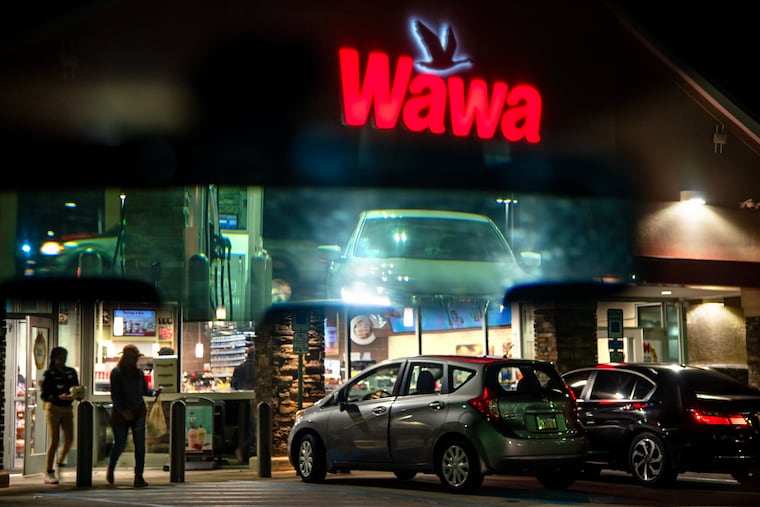 A Cherry Hill, N.J. Wawa at night, with reflection in rear view mirror Dec. 6, 2017.