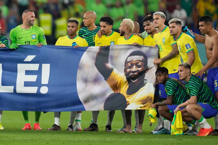 Brazil's players shows a banner in support of Brazilian soccer legend Pele at the World Cup.