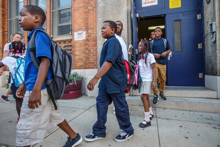 Too hot for school: District kids, like these at Dunbar Elementary in North Philadelphia. were dismissed early this week from their broiling classrooms.