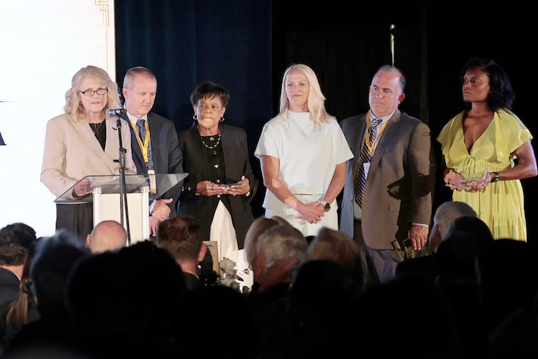 The Dawn Staley Legacy Award was given to (left to right) Cindy Griffin, Mike McLaughlin, Diane Richardson, Amy Mallon, Mountain MacGillivray, and Michelle Sword receiving an award for Denise Dillon at the Philadelphia Sports Legacy Honors dinner on Wednesday.