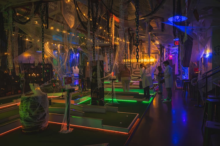 Frankenstein's Putt Putt at Libertee Grounds welcomes guests to an experimental mini golf and cocktail experience, complete with lab coats, goggles, and Halloween-themed sips.