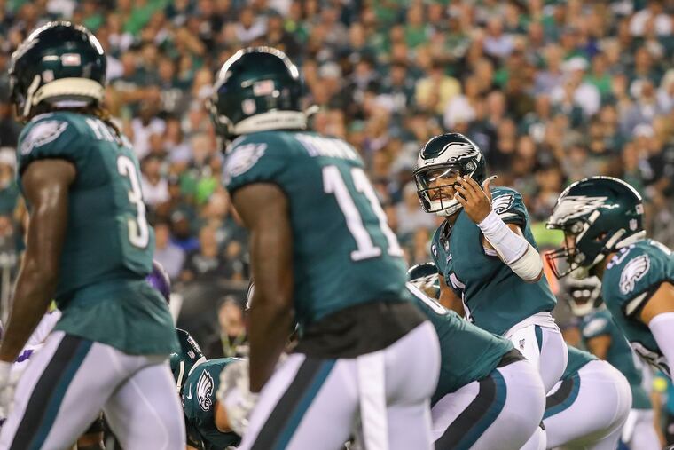 Philadelphia Eagles quarterback Jalen Hurts looks over to his receivers, including A.J. Brown (11), while calling a play against the Minnesota Vikings during Week 2.
