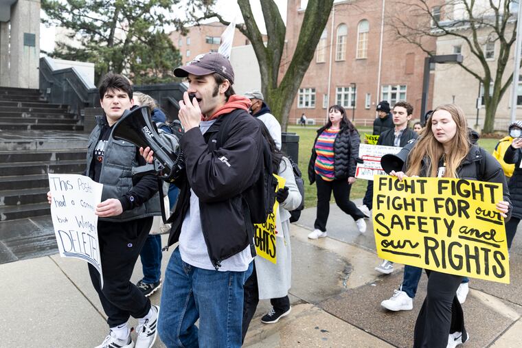 Greg Masters, of Bucks County, Pa., Second year studying Jazz Performance, leads chants as he marches along Broad Street with John Mangan, of Bucks County, Pa., Senior Finance Major and Founder of Keep us Safe, during a rally at Temple University in Philadelphia, Pa., on Tuesday, Feb. 28, 2023.