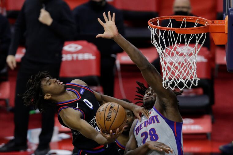 Sixers guard Tyrese Maxey gets fouled driving to the basket against Detroit Pistons center Isaiah Stewart during the fourth quarter on Saturday, May 8, 2021.