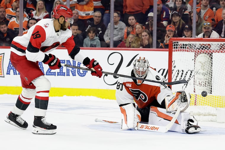 Flyers goaltender Dan Vladař stops Carolina Hurricanes defenseman K'Andre Miller’s shootout attempt on April 13.