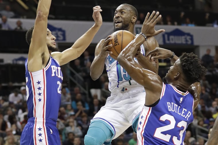 Hornets guard Kemba Walker, middle, has feasted on the SIxers defense this season.