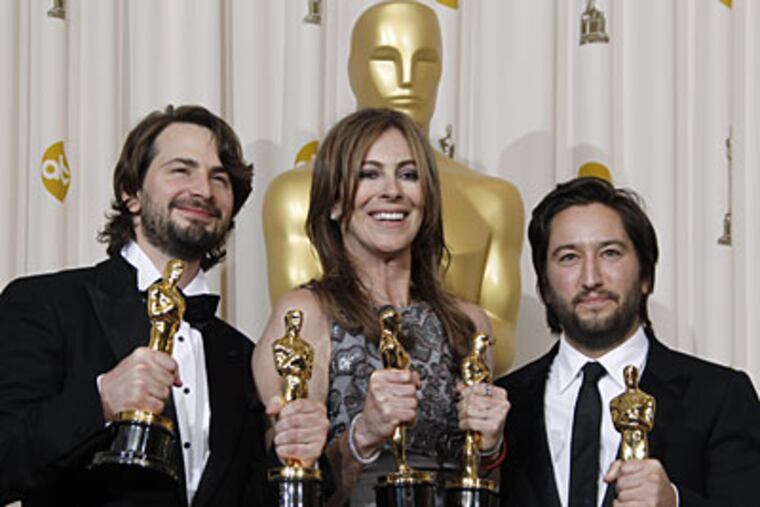 From left, screen writer Mark Boal, director Kathryn Bigelow and producer Greg Shapiro pose backstage with their Oscars for screen writing, directing and best movie for “The Hurt Locker” at the 82nd Academy Awards Sunday, March 7, 2010, in the Hollywood section of Los Angeles. (AP Photo/Matt Sayles)
