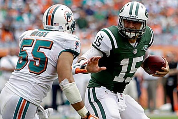 Jets quarterback Tim Tebow could see time at running back in the New York Jets' banged-up backfield against the New England Patriots on Sunday. (Lynne Sladky/AP)