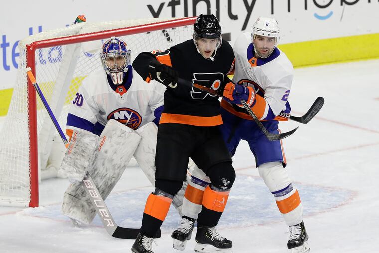 Left winger Oskar Lindblom, battling against the Islanders earlier this season, was among several Flyers taken out of Wednesday's lineup against the Rangers.