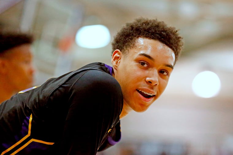 Roman Catholic guard Lynn Greer III shares a light moment with an acquaintance in the stands after a dunk against Central Bucks West in the fourth quarter of a PIAA Class 6A basketball quarterfinal Saturday, March 17, 2018, at Bensalem. Roman went on to win, 75-56. LOU RABITO / Staff