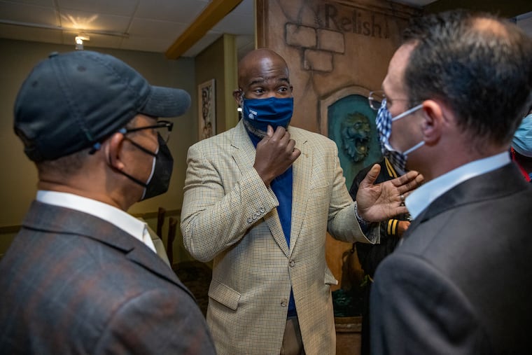 Business-friendly City Councilmember Derek Green (center) was central to the tax cut negotiations that led to Council's new budget plan.