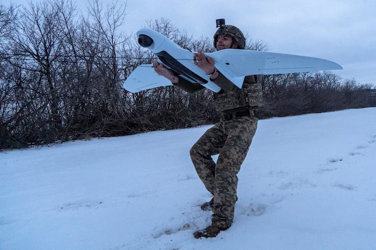 A Ukrainian soldier of the 48th separate brigade launches a reconnaissance drone in Kharkiv region, Ukraine, Wednesday, March 4, 2026.