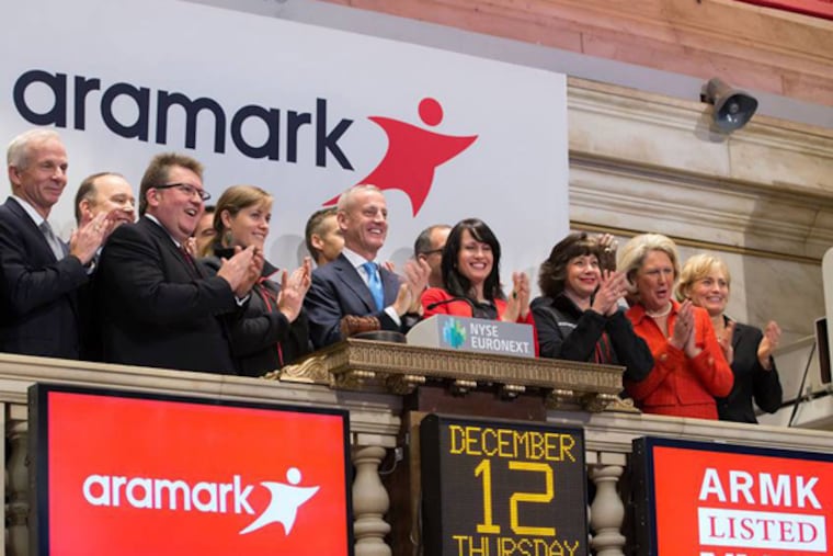 Eric Foss, President and CEO of Aramark, rings the Opening Bell at the New York Stock Exchange on December 12, 2013 in New York City. (Photo by Ben Hider/NYSE Euronext)