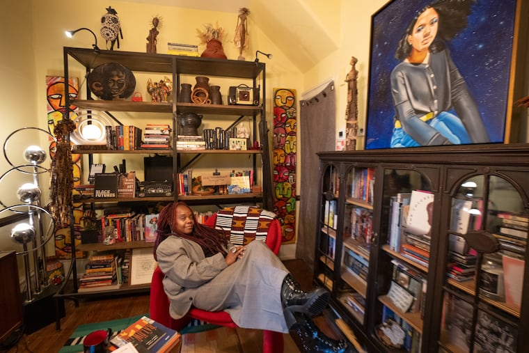 Vashti DuBois sits in the living room turned library in her Germantown House Museum The Colored Girls Museum. For the current show, "Say It Loud, I'm Black and I'm Proud," the room is named, "Keep My Name Out Yo Mouth"