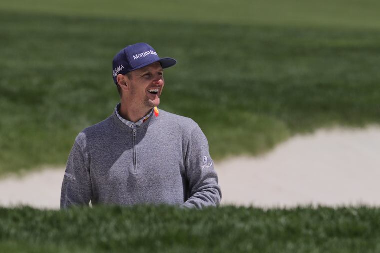 Justin Rose reacts after hitting our of a bunker on the ninth hole during a practice round for the PGA Championship.
