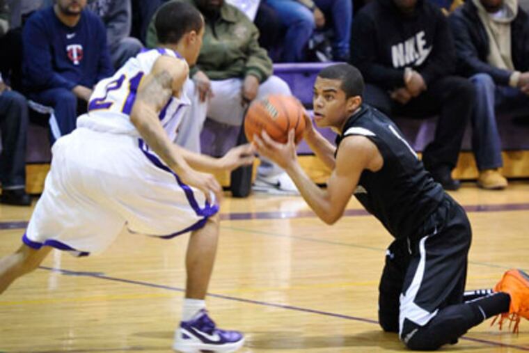 Bishop Eustace's Carson Puriefoy and Camden's Kadir Walker cfight for a loose ball. (Ron Tarver / Staff Photographer)