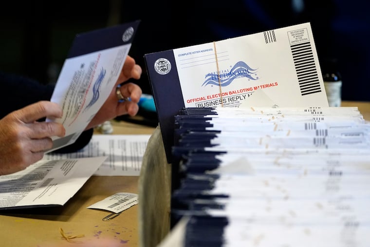 File photo of election workers processing mail-in and absentee ballots for the 2020 general election in Pennsylvania. (AP Photo/Matt Slocum)