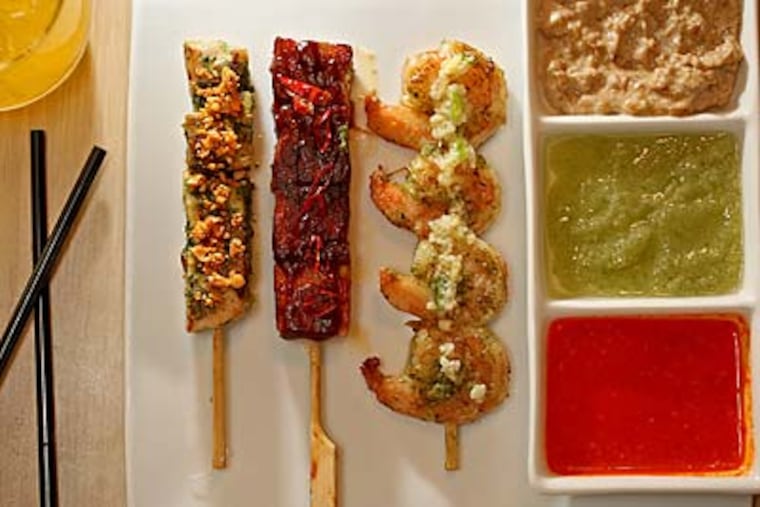 A sampling of anticuchos at Chifa. (Michael Bryant/Staff Photographer)