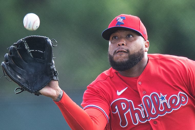 Phillies pitcher, Jose Alvarado fields a ball during spring training practice in February.